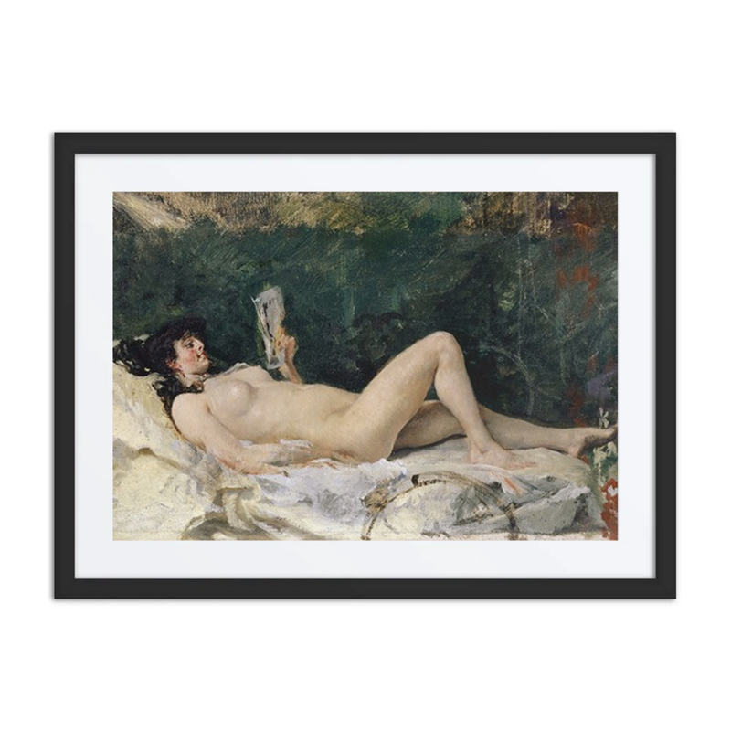 Young Woman Lying on a Bed and Reading